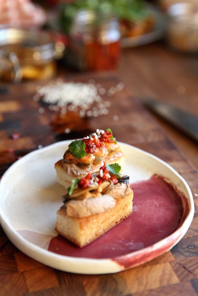 Delicious gourmet pincho appetizers served on a ceramic plate, perfect for a culinary delight.